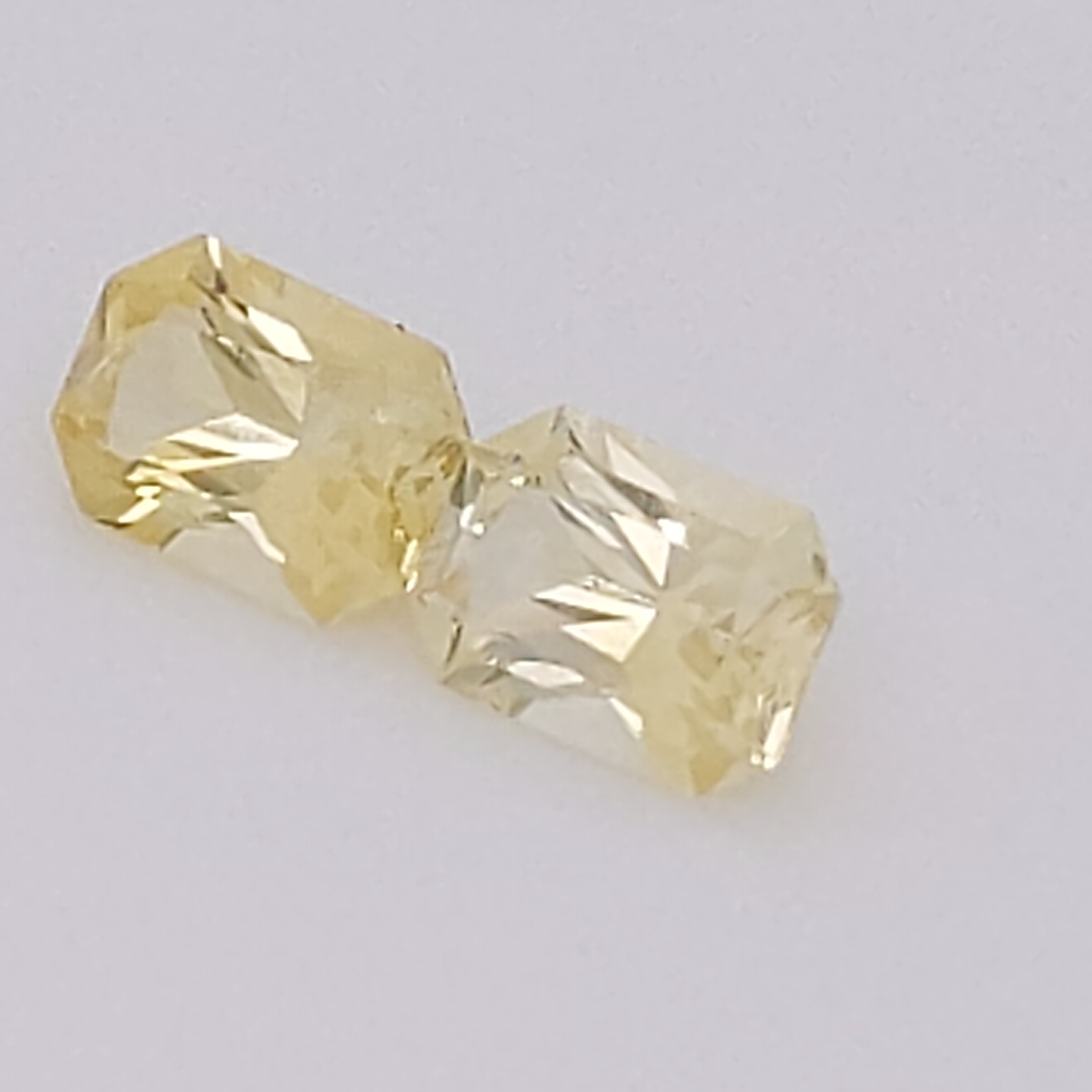 Ceylon emerald cut yellow sapphire pair